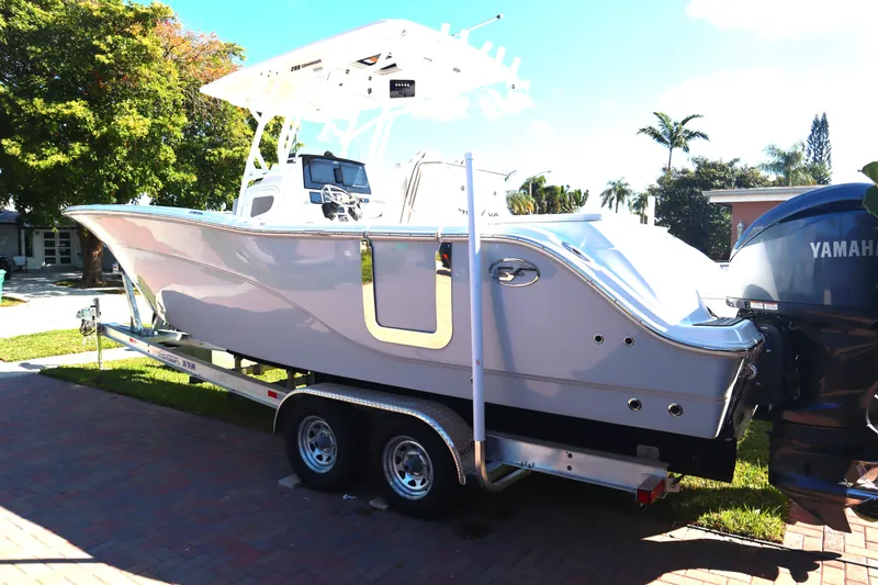 Slide: The Image of 2022 Sea Fox 288 Commander boat on trailer, parked outdoors. - 39