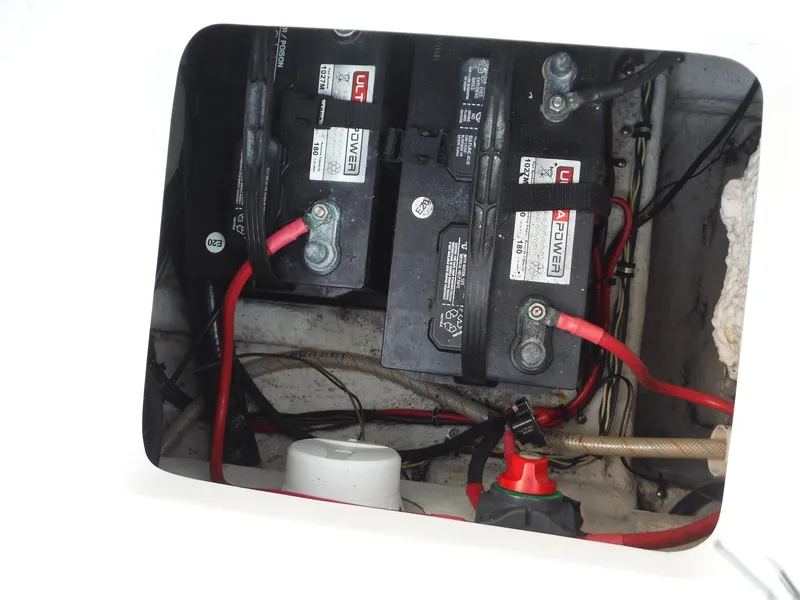 Slide: The Image of Battery compartment of 2016 Sea Hunt Escape 235 SE boat, showing wiring and connections. - 25