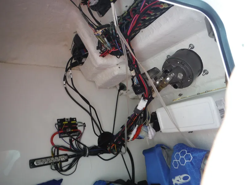Slide: The Image of Interior wiring of a 2016 Sea Hunt Escape 235 SE boat, showcasing electrical components and connections. - 28