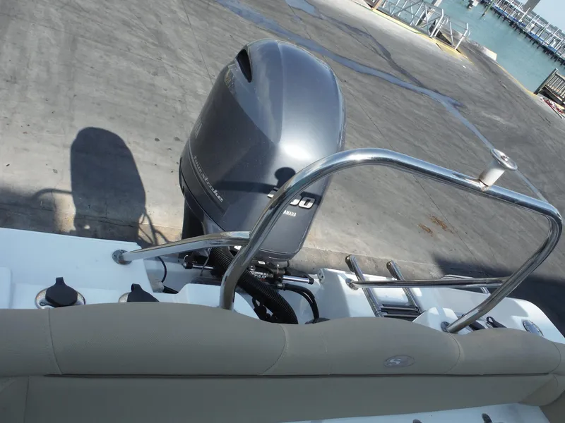 Slide: The Image of 2016 Sea Hunt Escape 235 SE boat with outboard motor at dock. - 29