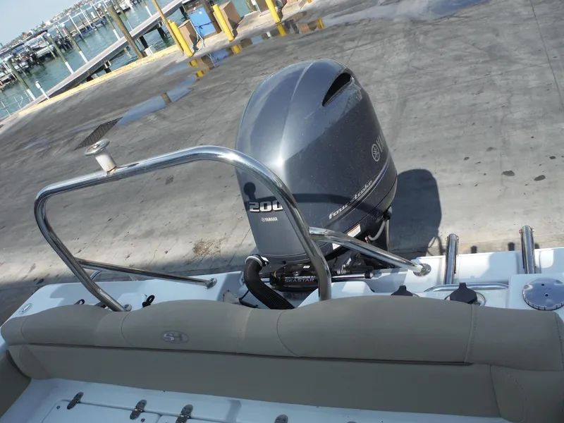 Slide: The Image of 2016 Sea Hunt Escape 235 SE boat with Yamaha 200 engine at dock. - 30