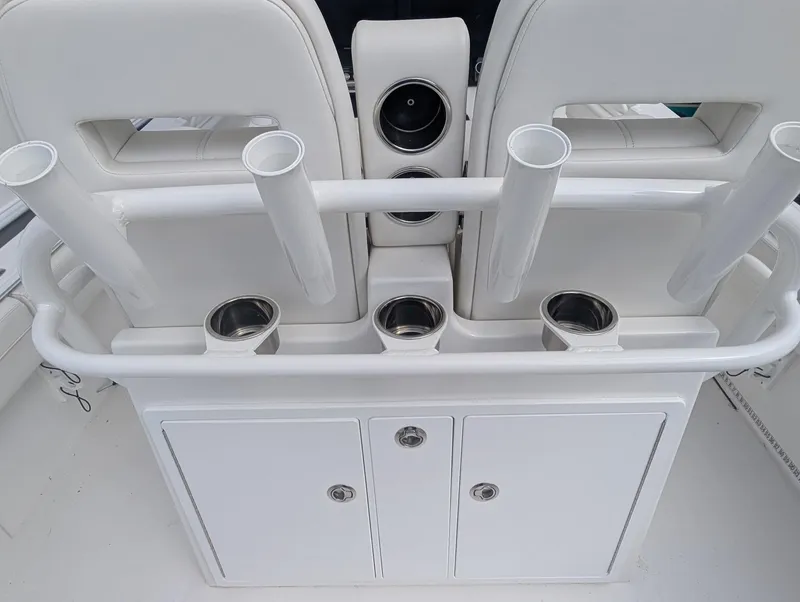 Slide: The Image of 2023 Regulator 28 boat interior with rod holders and storage compartments. - 16