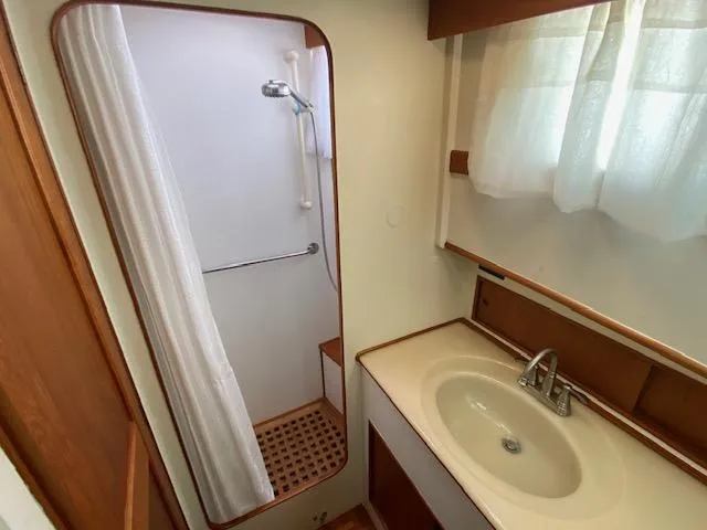 Slide: The Image of Bathroom interior of a 1993 Grand Banks Classic yacht with shower and sink. - 19
