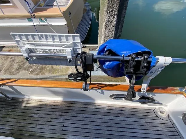 Slide: The Image of Deck of 1993 Grand Banks Classic boat with mounted equipment and blue cover. - 34