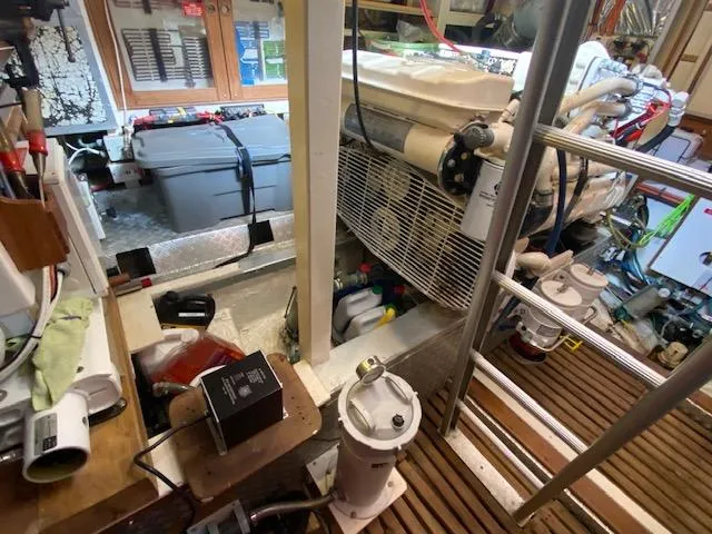 Slide: The Image of Engine room of a 1993 Grand Banks Classic boat, featuring equipment and storage. - 41