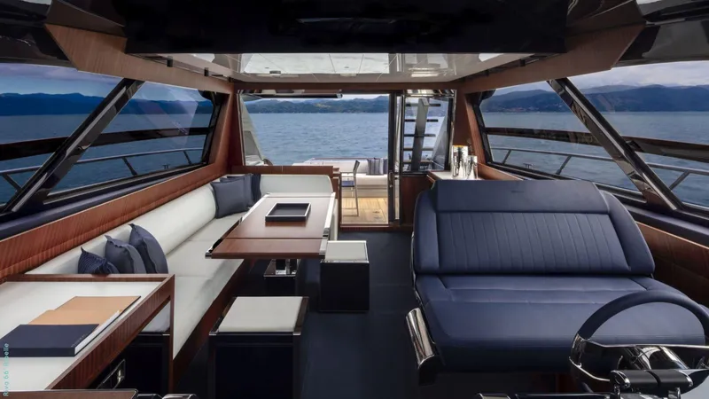 Slide: The Image of Luxurious 2024 Riva 66' Ribelle yacht with elegant deck and plush seating at marina. - 10