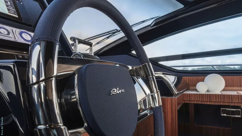 Slide: The Image of Luxurious interior of 2024 Riva 66' Ribelle yacht with elegant wooden staircase. - 12