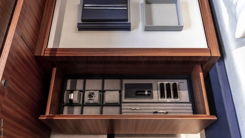 Slide: The Image of 2024 Riva 66' Ribelle yacht helm with modern controls and waterfront view. - 15