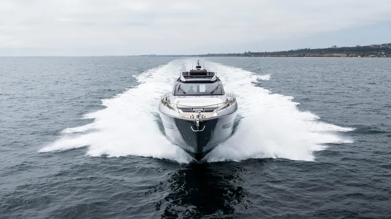 Slide: The Image of 2024 Riva 66' Ribelle yacht cruising on open water, front view. - 2