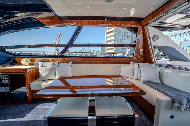 Slide: The Image of Luxurious interior of 2024 Riva 66' Ribelle yacht with elegant seating and panoramic windows. - 23