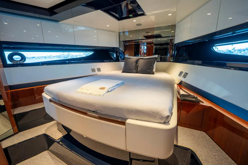 Slide: The Image of Luxurious bedroom interior of 2024 Riva 66' Ribelle yacht with modern design and elegant furnishings. - 30