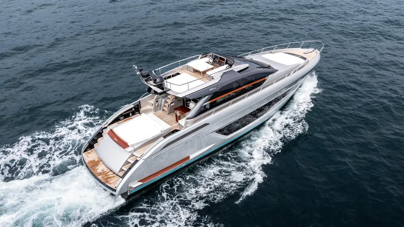 Slide: The Image of 2024 Riva 66' Ribelle yacht cruising on open water, showcasing sleek design and luxury. - 5