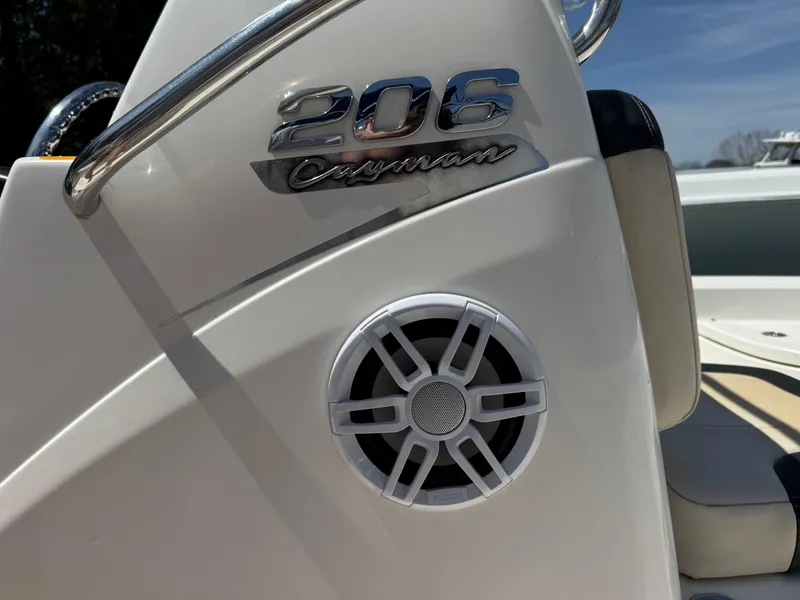 Slide: The Image of 2014 Robalo 206 Cayman boat console with speaker and logo detail. - 11