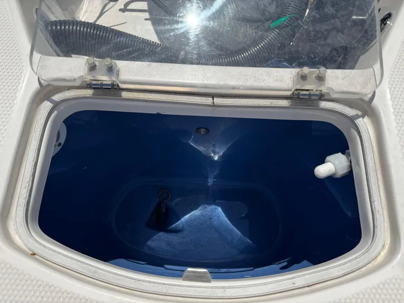 Slide: The Image of Livewell compartment on a 2014 Robalo 206 Cayman boat, open lid view. - 13