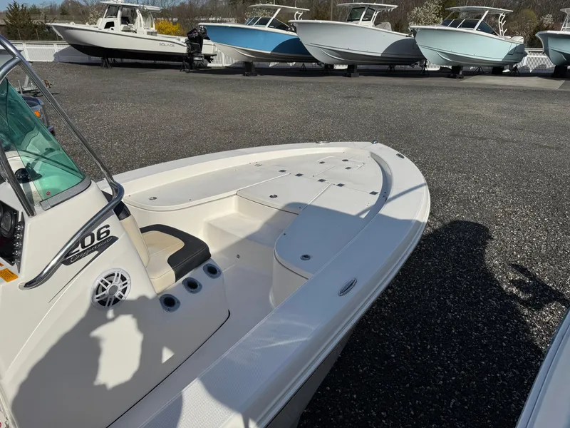Slide: The Image of 2014 Robalo 206 Cayman boat on display with other vessels in the background. - 2
