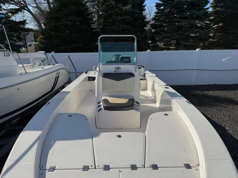 Slide: The Image of 2014 Robalo 206 Cayman boat with center console, parked outdoors. - 3