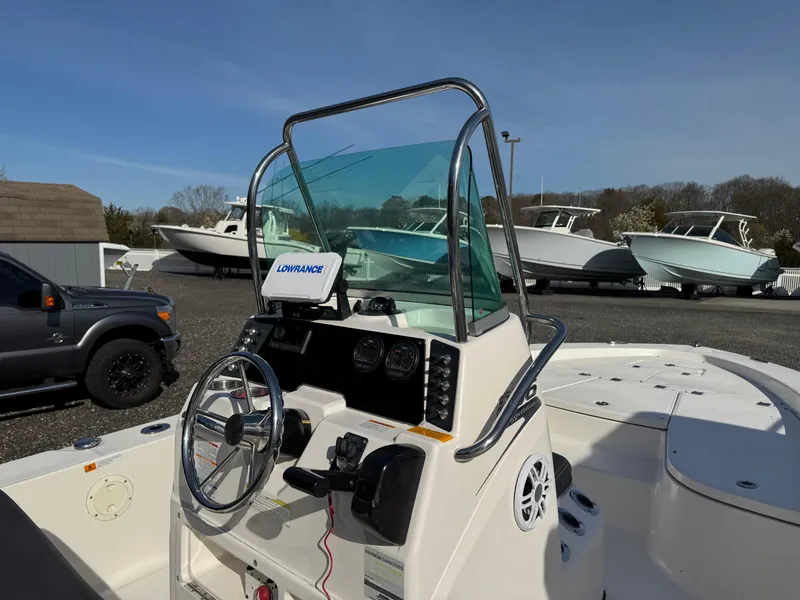 Slide: The Image of 2014 Robalo 206 Cayman boat dashboard with steering wheel and navigation system. - 8
