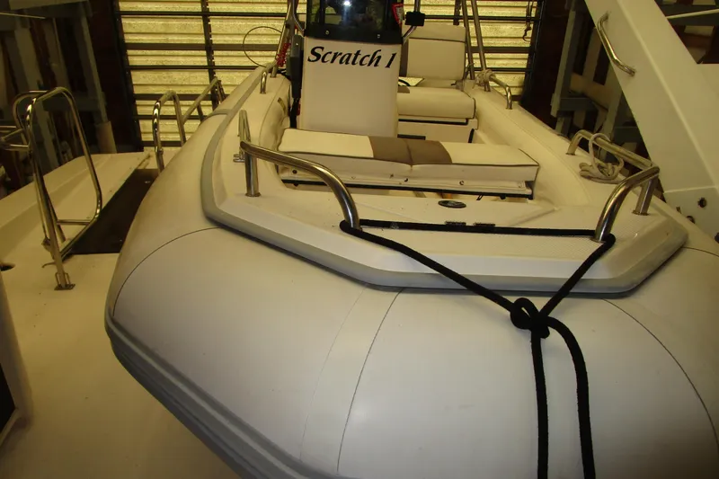 Slide: The Image of 1999 Bayliner 4788 Pilot House Motoryacht with inflatable tender on deck. - 31