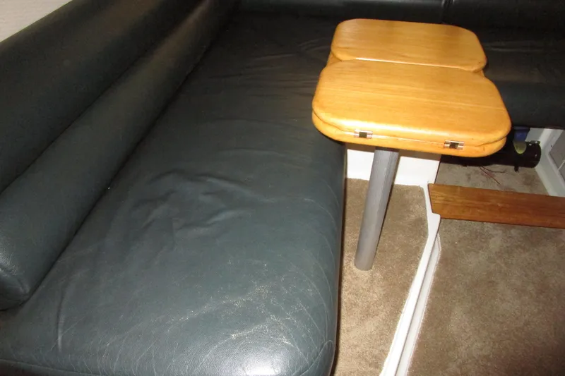 Slide: The Image of Interior seating and table of 1999 Bayliner 4788 Pilot House Motoryacht. - 39