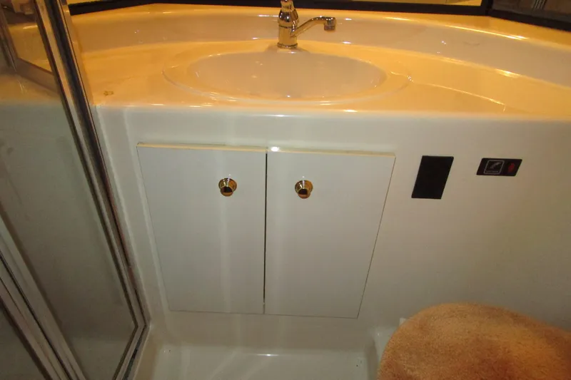 Slide: The Image of Bathroom sink area in 1999 Bayliner 4788 Pilot House Motoryacht. - 46