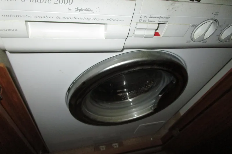 Slide: The Image of Splendide washer-dryer unit inside 1999 Bayliner 4788 Pilot House Motoryacht. - 48