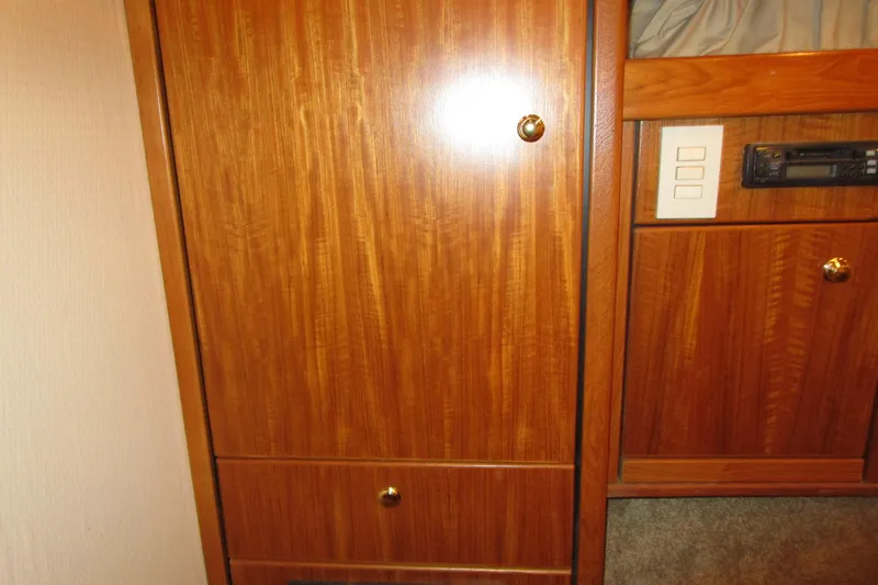 Slide: The Image of Wooden interior cabinetry of a 1999 Bayliner 4788 Pilot House Motoryacht. - 54