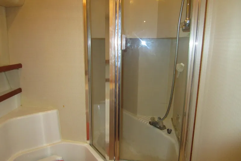 Slide: The Image of Bathroom interior of 1999 Bayliner 4788 Pilot House Motoryacht with shower and fixtures. - 62