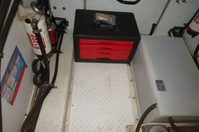 Slide: The Image of Engine room of 1999 Bayliner 4788 Pilot House Motoryacht with toolbox and equipment. - 73