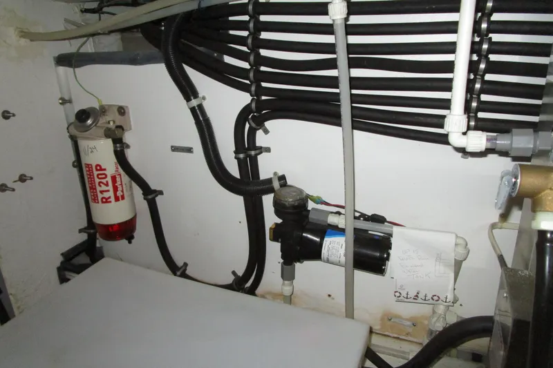 Slide: The Image of Engine room of 1999 Bayliner 4788 Pilot House Motoryacht with fuel filter and hoses. - 74