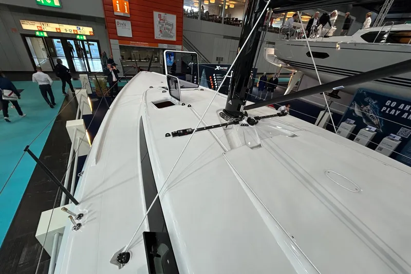 Slide: The Image of 2025 X-Yachts XR 41 sailboat on display at an indoor boat show. - 13