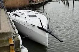 Slide: The Image of 2027 X-Yachts XR 41 sailboat docked in a marina, showcasing sleek design and modern features. - 12