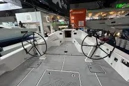 Slide: The Image of 2025 X-Yachts XR 41 yacht interior with dual steering wheels at a boat show. - 15