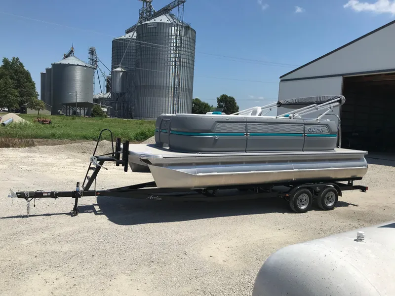 The Image of Man fishing with excitement; Avalon AURA 2025 promotion for Mercury outboard coverage. - 0