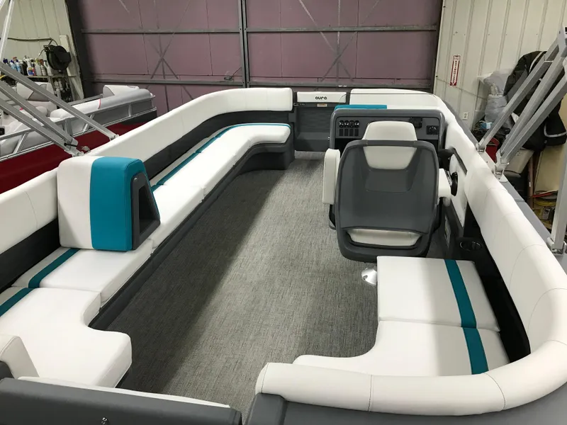 Slide: The Image of Avalon AURA 2025 pontoon boat in a garage, showcasing sleek design and modern features. - 10