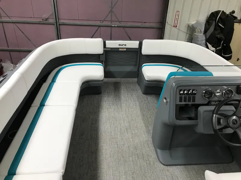 Slide: The Image of 2025 Avalon AURA boat interior with modern steering console and seating arrangement. - 13