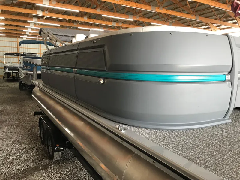 Slide: The Image of 2025 Avalon AURA pontoon boat in a storage facility, showcasing modern design and structure. - 21