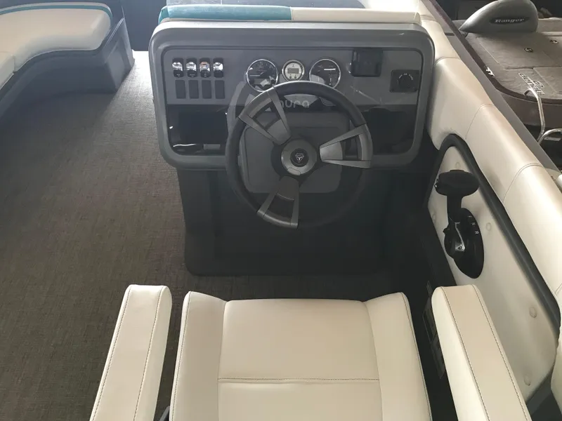 Slide: The Image of 2025 Avalon AURA pontoon boat in storage, featuring sleek design and modern detailing. - 23