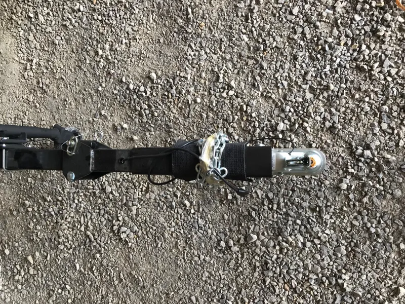 Slide: The Image of 2025 Avalon AURA pontoon boat interior with white and teal seating in a showroom. - 26