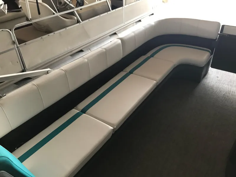 Slide: The Image of Interior of 2025 Avalon AURA boat with spacious seating and modern helm. - 29