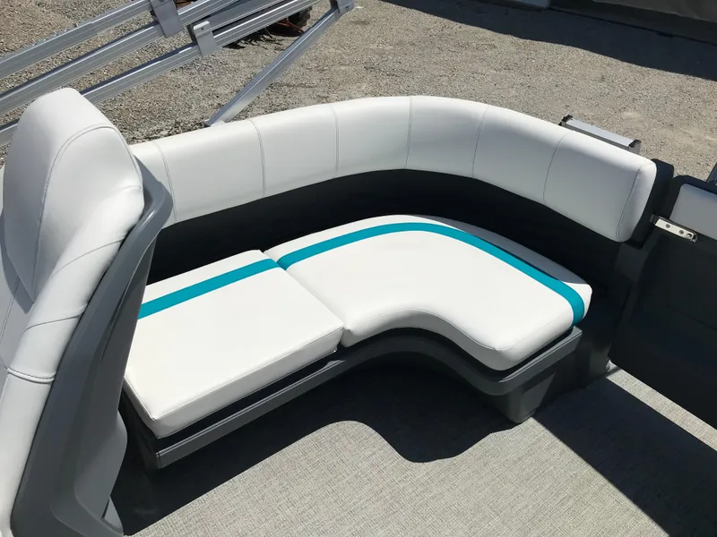 Slide: The Image of 2025 Avalon AURA boat interior with white captain's chair and steering wheel. - 34