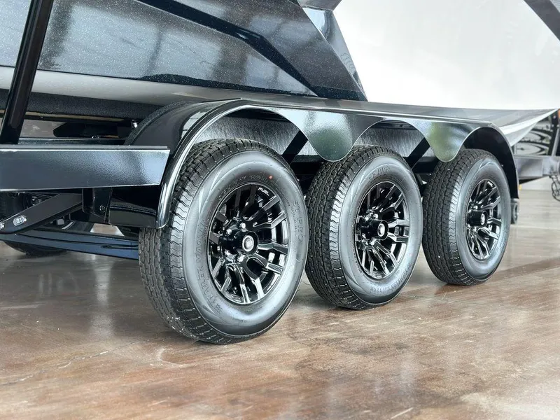 Slide: The Image of Triple-axle trailer with black wheels for 2025 Axis A245 boat. - 14