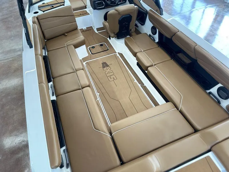 Slide: The Image of 2025 Axis A245 boat interior with tan leather seating and sleek design. - 18