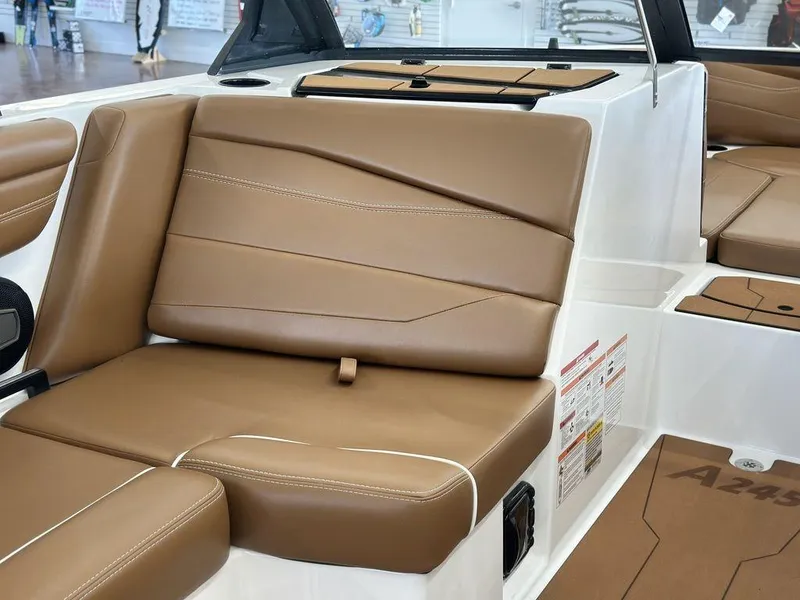 Slide: The Image of 2025 Axis A245 boat interior with tan leather seating and modern design. - 5
