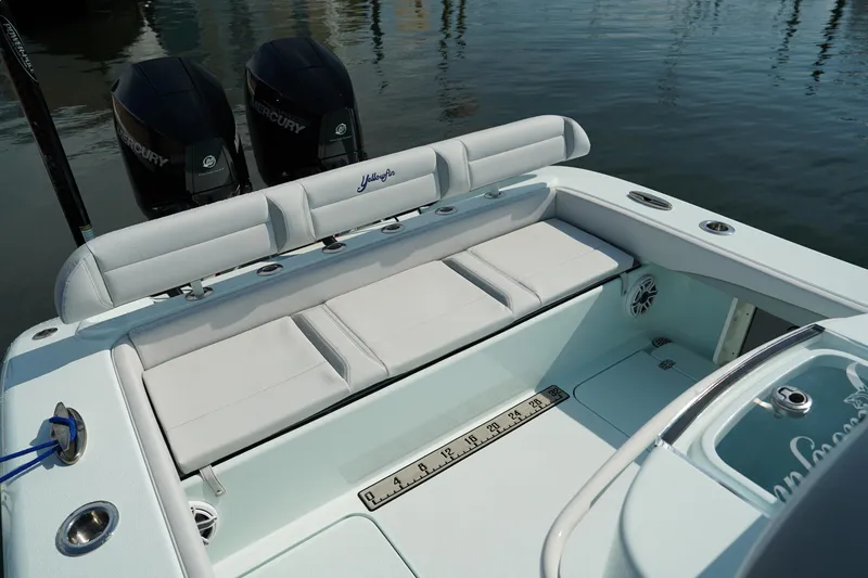 Slide: The Image of 2020 Yellowfin 26 Hybrid boat with cushioned seating and dual Mercury engines. - 13