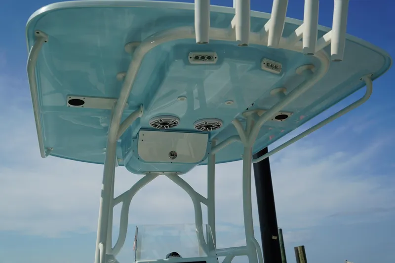 Slide: The Image of T-top of 2020 Yellowfin 26 Hybrid boat with speakers and rod holders. - 22