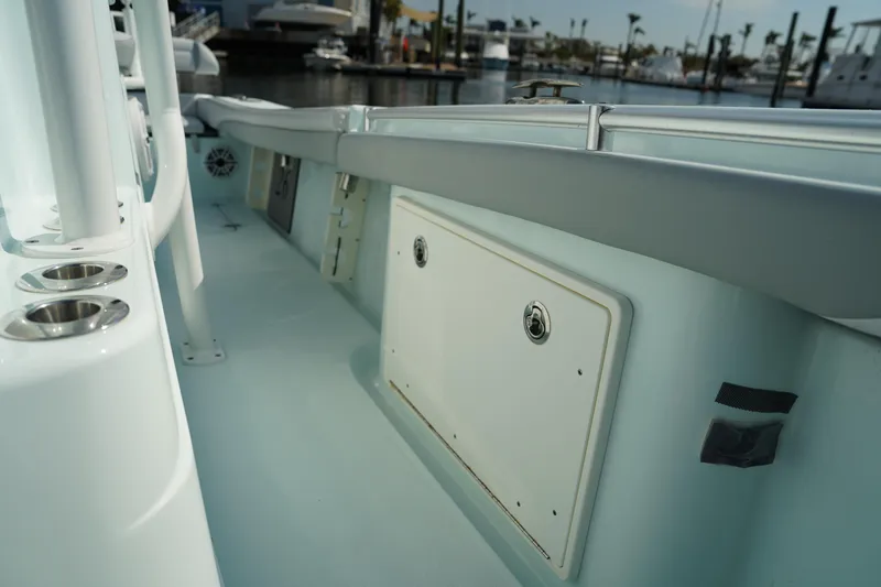 Slide: The Image of 2020 Yellowfin 26 Hybrid boat interior with storage compartments and cup holders. - 27