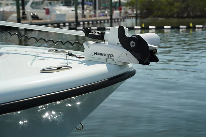 Slide: The Image of 2020 Yellowfin 26 Hybrid boat with Minn Kota Terrova trolling motor on calm water. - 37