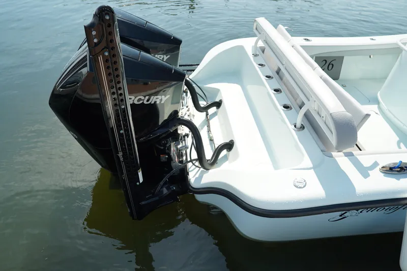 Slide: The Image of 2020 Yellowfin 26 Hybrid boat with dual Mercury outboard engines on water. - 8