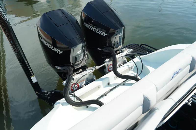 Slide: The Image of 2020 Yellowfin 26 Hybrid boat with dual Mercury outboard engines on water. - 9