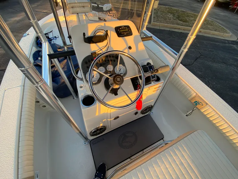 Slide: The Image of 2017 Carolina Skiff Sea Skiff 21CC boat console with steering wheel and gauges. - 16